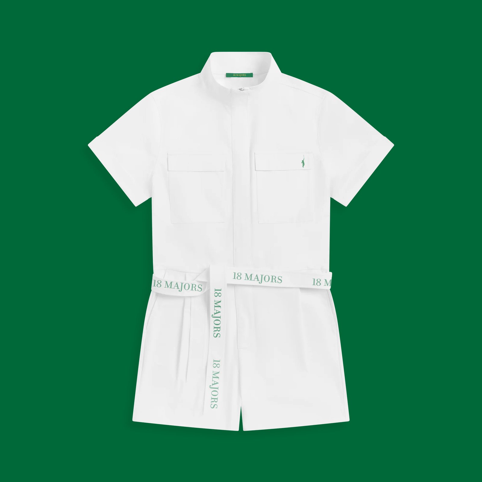 The caddie suit laid flat on a green ground, 18 Majors jacquard belt across the waist.