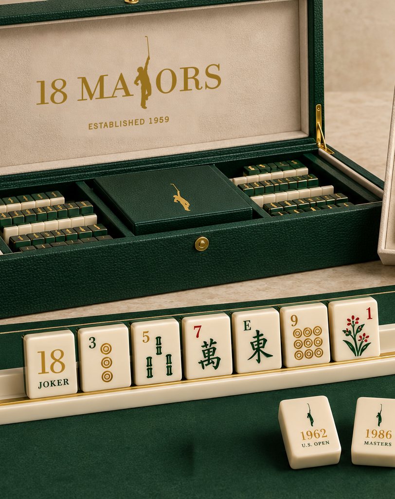 An 18 Majors mahjong set, green lacquered box with the gold name and tiles carrying the golfer silhouette.